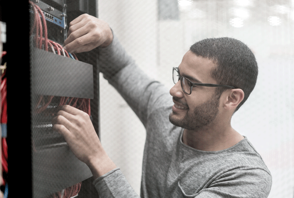 IT technician fixing a server at the office